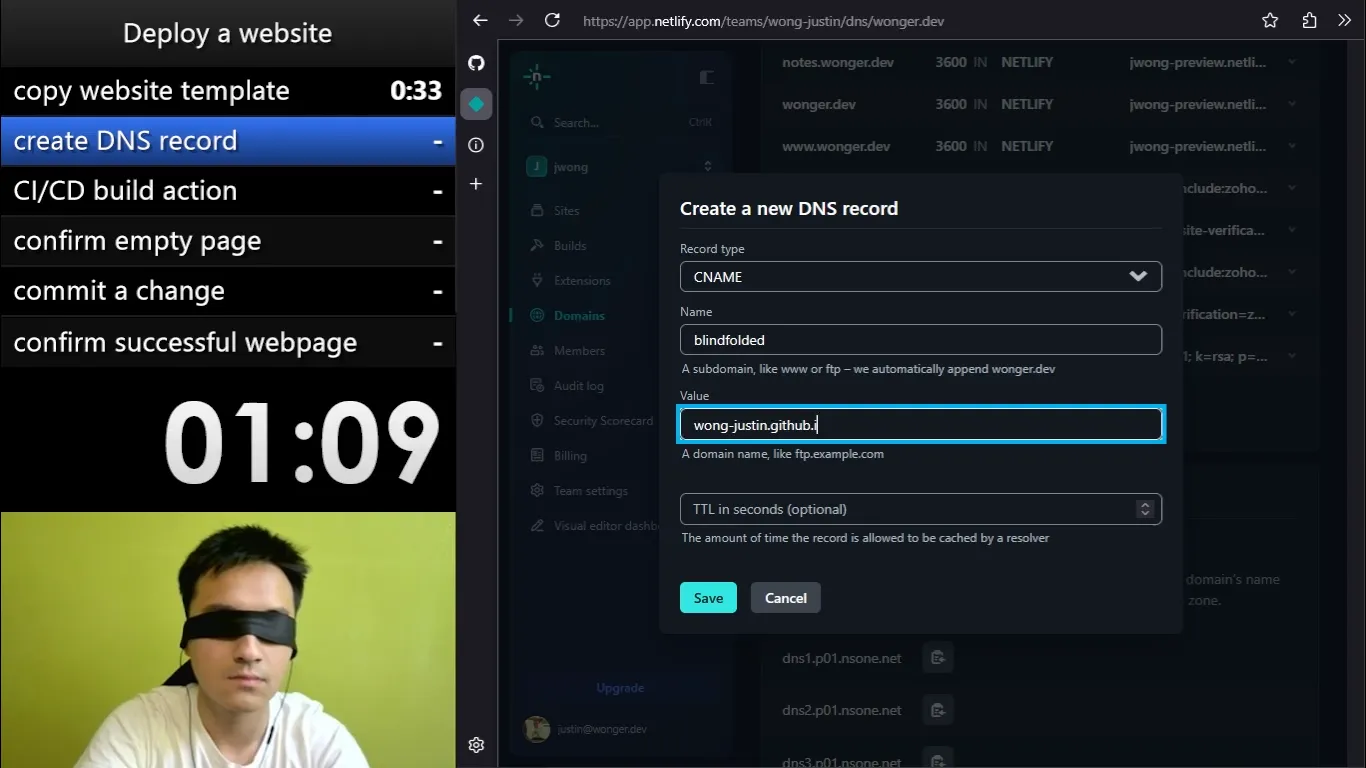 In one corner of the screen, I wear a blindfold. There is a checklist entitled 'deploy a website.' The current task is 'create DNS record', and the timer shows one minute, nine seconds. The rest of the screen is taken up by a web browser, which shows a form for creating a DNS record, with fields such as 'record type' and 'name.'